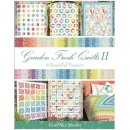 Die Ansicht zeigt das Cover des Patchworkbuches Garden Fresh Quilts 2. Auf ihm sind 6 Quilts in regenbogenfarbenen kleinen Blumenmustern dargestellt.
